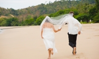 Couple Running On Beach